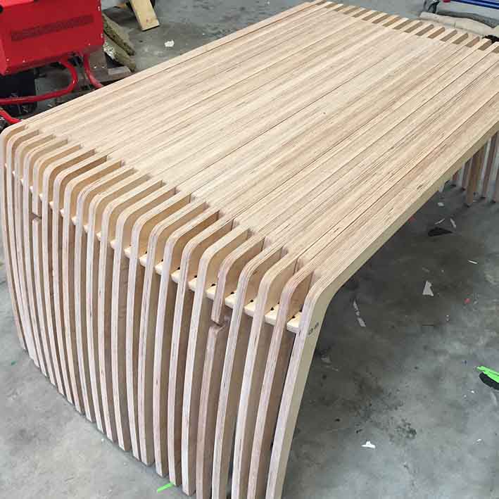 CNC cut extending wooden bench for office